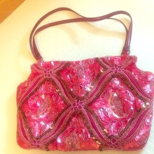Beautiful beaded bright colored purse.